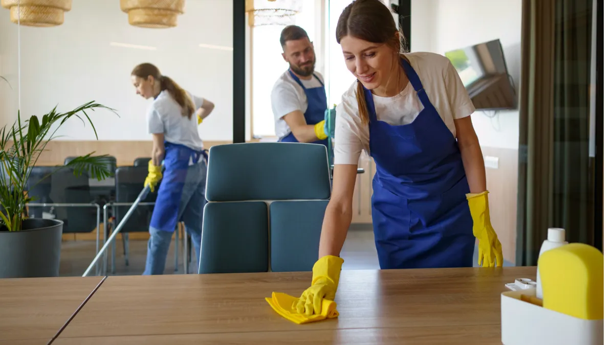 Professional cleaning team servicing a commercial office