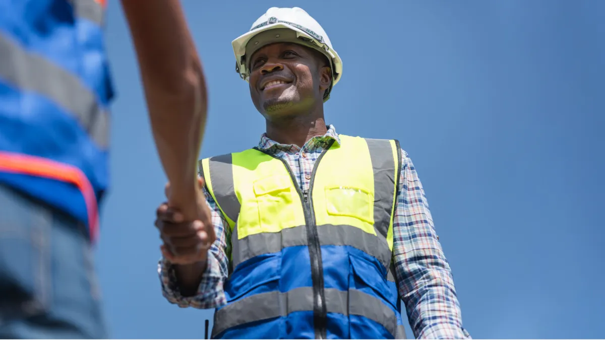 Service business professionals shaking hands after a hire or agreement